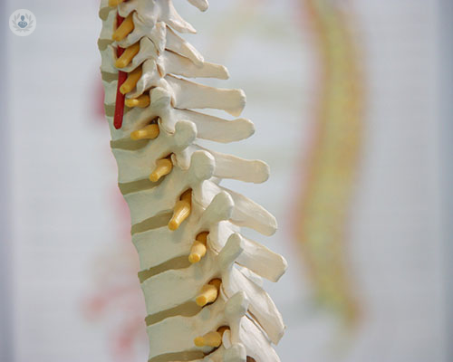 How can spinal disc problems be solved with surgery?